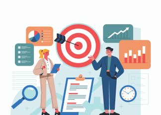 Two marketers standing near a target board with charts and reports