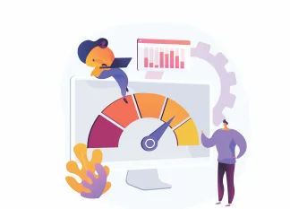 Two people analyzing data on a computer screen with a performance meter